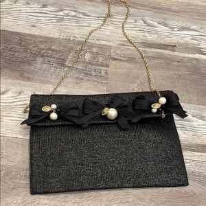 Teria Yabar Black and Gold Handbag with Elegant Bow & Pearl Accents